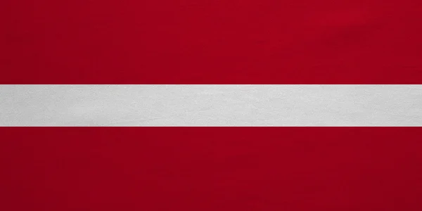 Bandiera della Lettonia tessuto reale dettagliato texture — Foto Stock