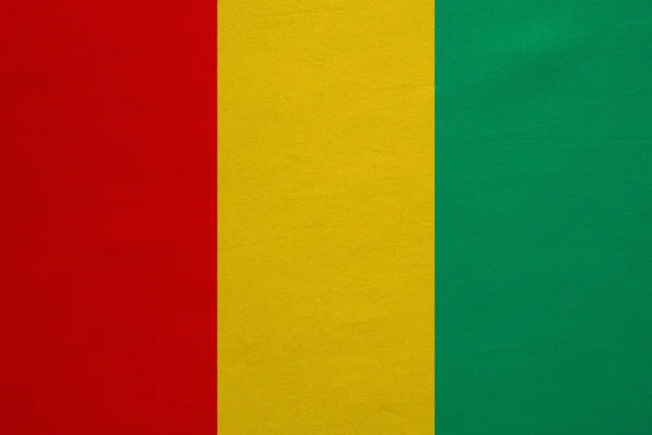 Valós Guinea zászlaja részletes szövet szerkezete — Stock Fotó