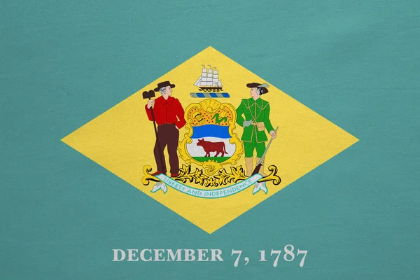 Bandera de Delaware textura de tela detallada real —  Fotos de Stock