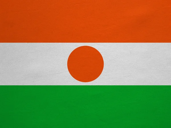 Flag of Niger real detailed fabric texture — Stock fotografie