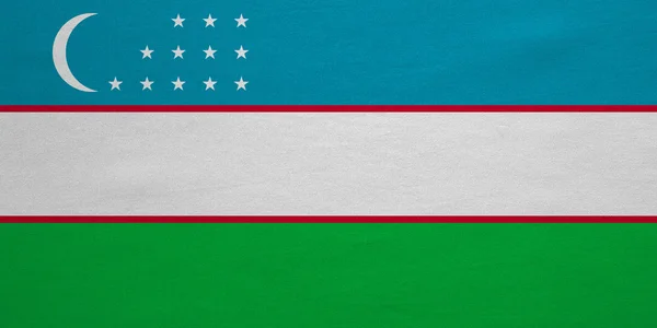 Flag of Uzbekistan real detailed fabric texture — Stock fotografie