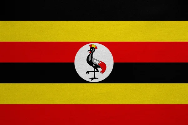 Bandeira de Uganda textura de tecido real detalhado — Fotografia de Stock