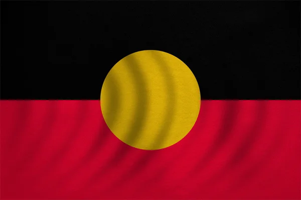Bandera aborigen australiana ondulada, textura de tela — Foto de Stock