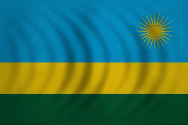 Bandiera del Ruanda ondulato, vera trama del tessuto dettagliato — Foto Stock