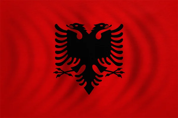 Bandeira da Albânia ondulada, textura de tecido real detalhado — Fotografia de Stock