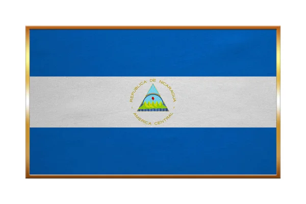 Flaga Nikaragui, złotej ramie, tekstura tkanina — Zdjęcie stockowe