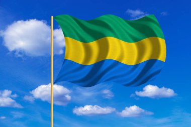 Gabon mavi gökyüzü arka plan üzerinde sallayarak bayrak