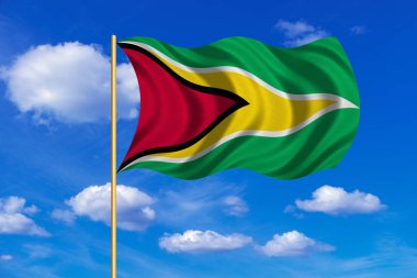 Mavi gökyüzü arka plan üzerinde Guyana sallayarak bayrak