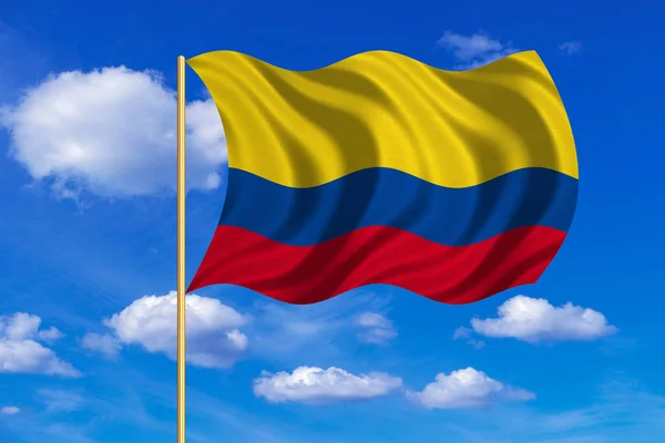 Kolumbia integet a kék ég háttér zászlaja — Stock Fotó