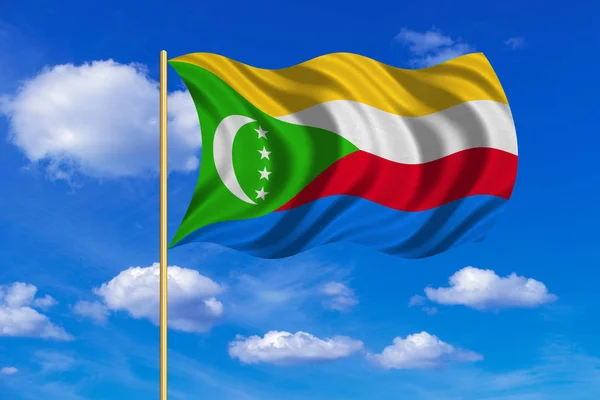 Bandera de Comoras ondeando sobre el fondo azul del cielo — Foto de Stock