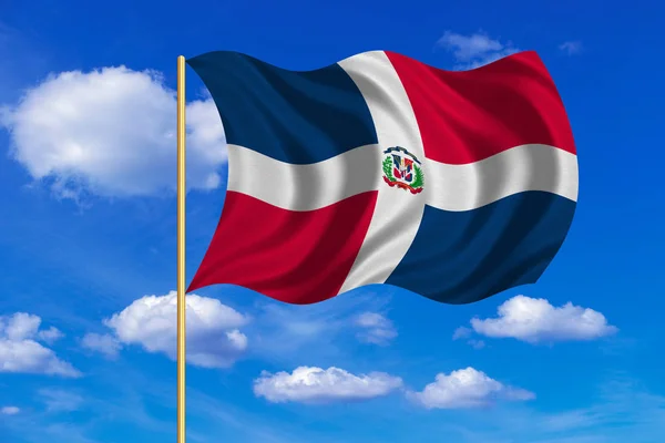 Dominikánská republika vlajka na stožáru vlnité, modrá obloha — Stock fotografie
