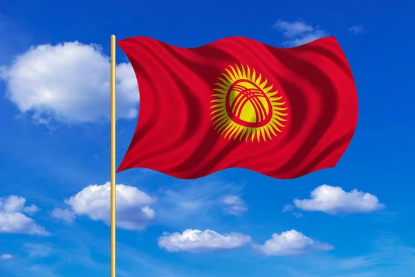 Vlajka Kyrgyzstánu mávat na pozadí modré oblohy — Stock fotografie