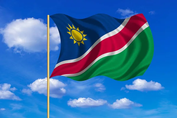 Flag of Namibia waving on blue sky background — Stock Photo, Image