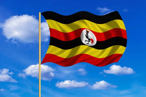 Flag of Uganda waving on blue sky background — Stock Photo, Image