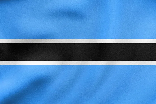 Bandiera del Botswana sventola, tessitura in tessuto reale — Foto Stock