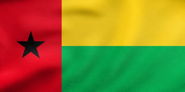 Bandeira da Guiné-Bissau acenando, textura de tecido real — Fotografia de Stock