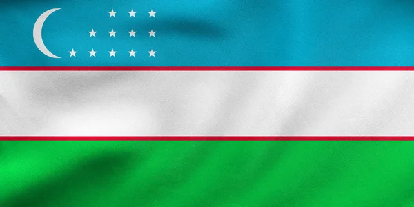 Bandera de Uzbekistán ondeando, textura de tela real — Foto de Stock