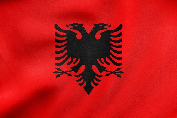 Σημαία της Αλβανίας κυματισμού, πραγματική υφή υφάσματος — Φωτογραφία Αρχείου