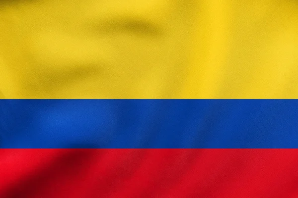 Bandeira da Colômbia acenando, textura de tecido real — Fotografia de Stock
