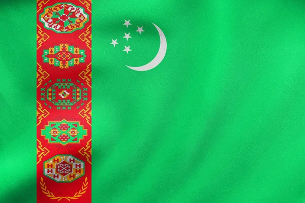 Vlajka Turkmenistánu mává, skutečné textilie textura — Stock fotografie