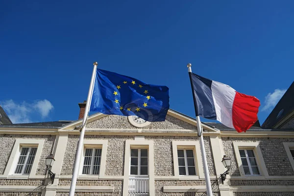 Flags of France and European Union waving in wind — Stock Photo, Image