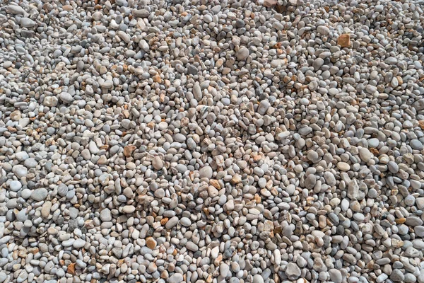 Pebbles on the beach for texture and background — Stock Photo, Image