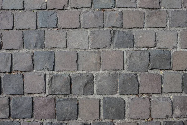 Pavement top view. Pavement texture. Background of old cobblesto.