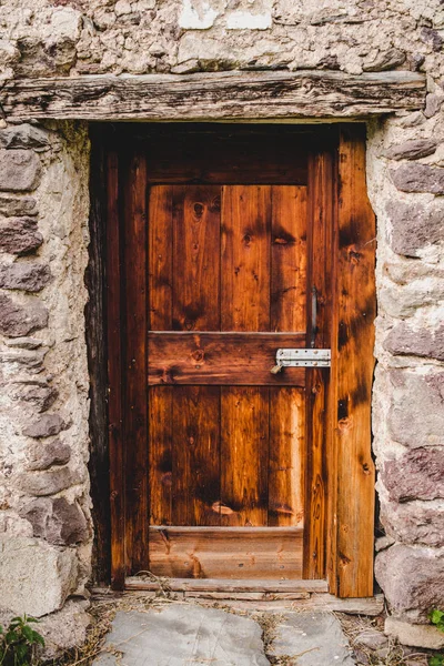 Door of a rustic constuction Alps Italy — Stock Photo, Image