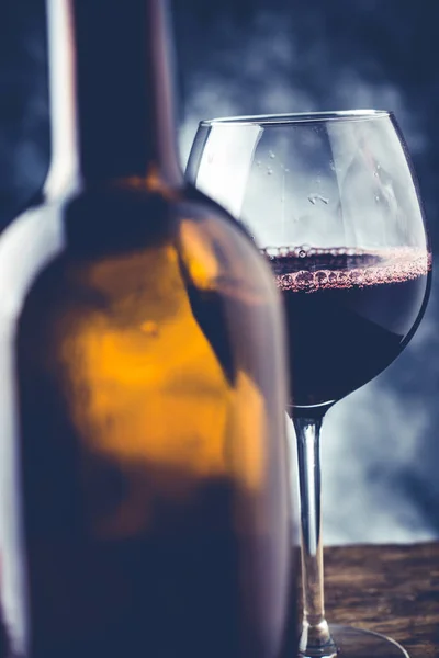 Red wine glass and bottle — Stock Photo, Image