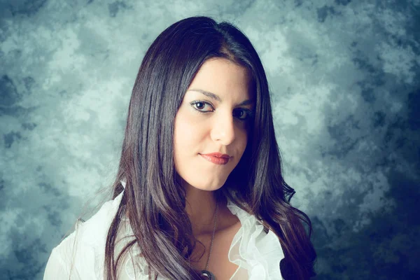 Self confident mediterranean young woman with long brown hair — Stock Photo, Image