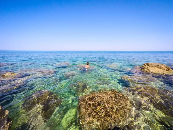 Teenager swim in the sea - summertime — Stock Photo, Image