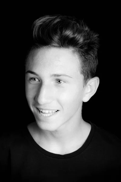 Young guy portrait on black background - black and white photo — Stock Photo, Image