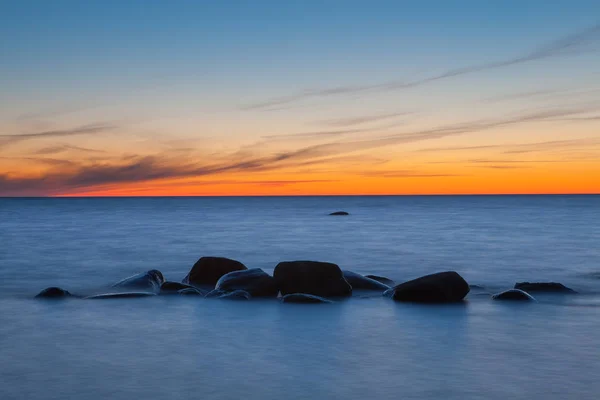 Minimalistic piture of sunrise on Baltic sea. Rocky coast of Estonian island — Stock Photo, Image