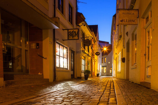 BREMEN, GERMANY - 17 APR 2016: Historic streets of illuminated Schnoor quarter at night