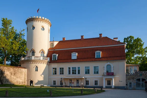 New white castle in old town of Cesis, Latvia. Part of ancient Livonian castle ruins. Greenery and summer daytime.