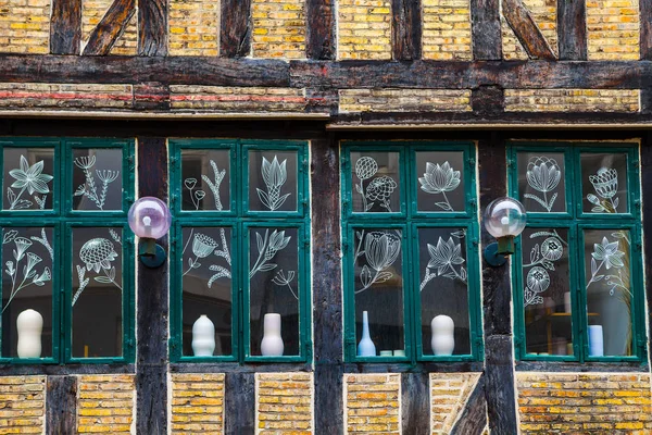 Vintage windows decorated with painting of flowers. Copenhagen, Denmark. — Stock Photo, Image