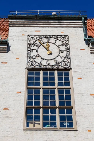 Ancient clock with golden arrows on old City hall wall. Hedemora, Sweden. — Stock Photo, Image