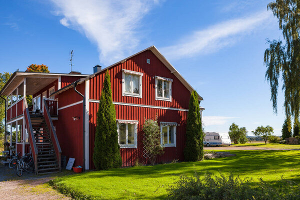 Red Swedish typical house in small town Hedemora
