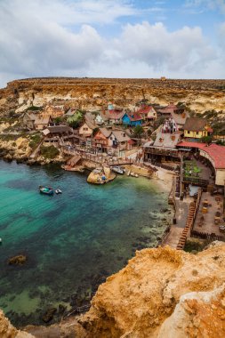 Famous Popeye village in Malta. Azure bay in the rocks clipart