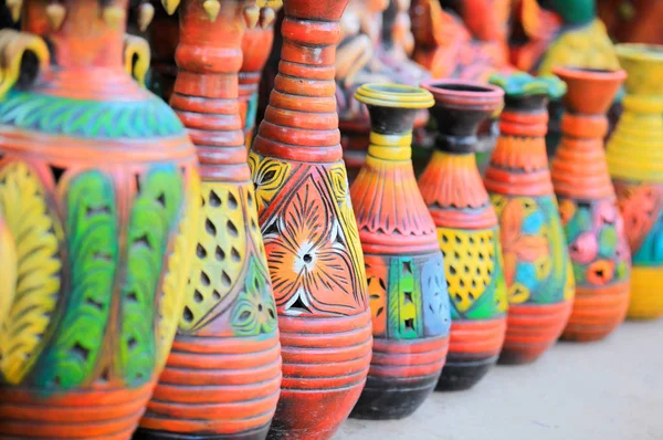 Colorful handcrafted pots in a row — Stock Photo, Image