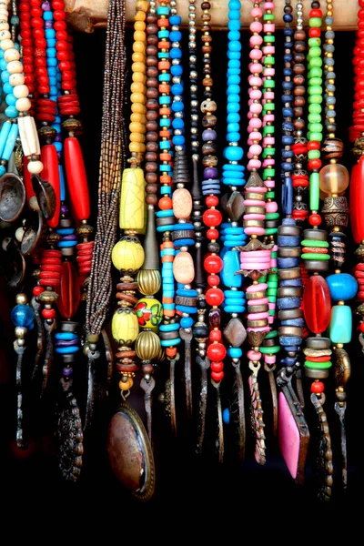 Indian handicrafts of colorful beads against black background