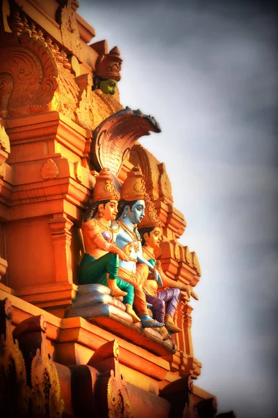 Hindu god Vishnu statue on the exterior temple wall