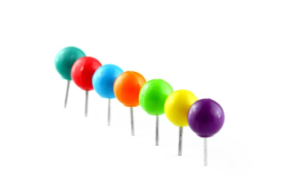 Row of colorful thumb tacks — Stock Photo, Image