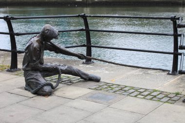 Linesman statue at Liffey river in Dublin clipart