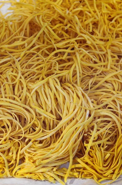 Raw italian tagliatelle pasta — Stock Photo, Image