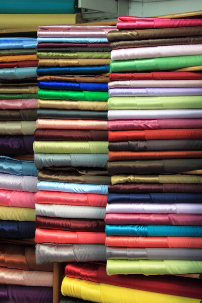 Colorful fabric rolls for sale in a haberdashery