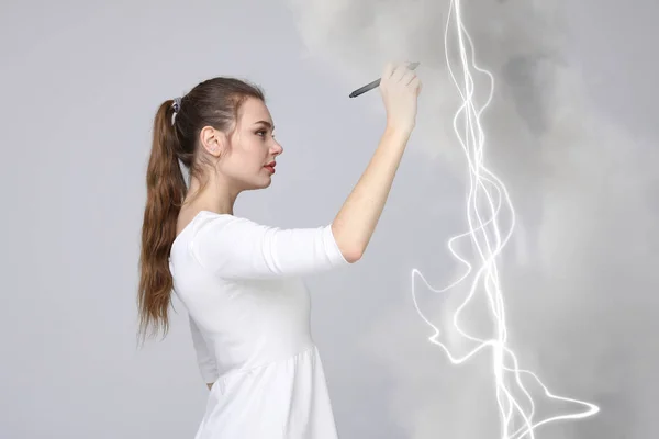 Woman making magic effect - flash lightning. The concept of electricity, high energy. — Stock Photo, Image