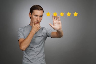 Five star rating or ranking, benchmarking concept. Man assesses service, hotel, restaurant clipart