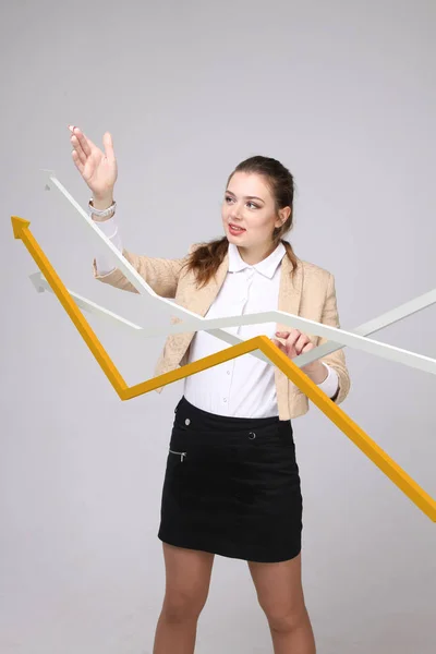 Businesswoman working with growth graph on grey background — Stock Photo, Image