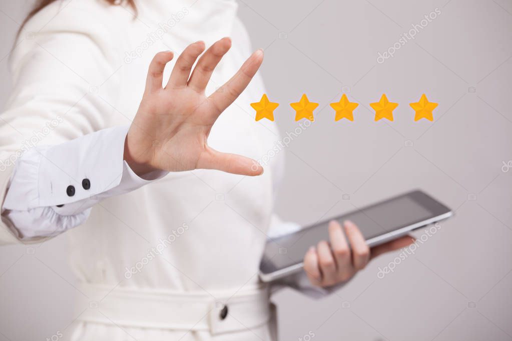 Five star rating or ranking, benchmarking concept. Woman assesses service, hotel, restaurant